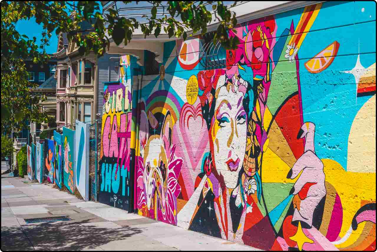 A vibrant wall covered with colorful graffiti art and bold designs.